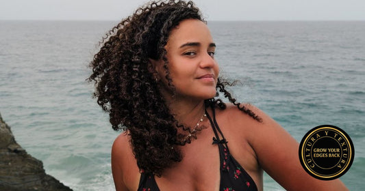 Afro-Latina woman with defined coily curls by the coast, Grow Your Edges Back Cultura y Textura