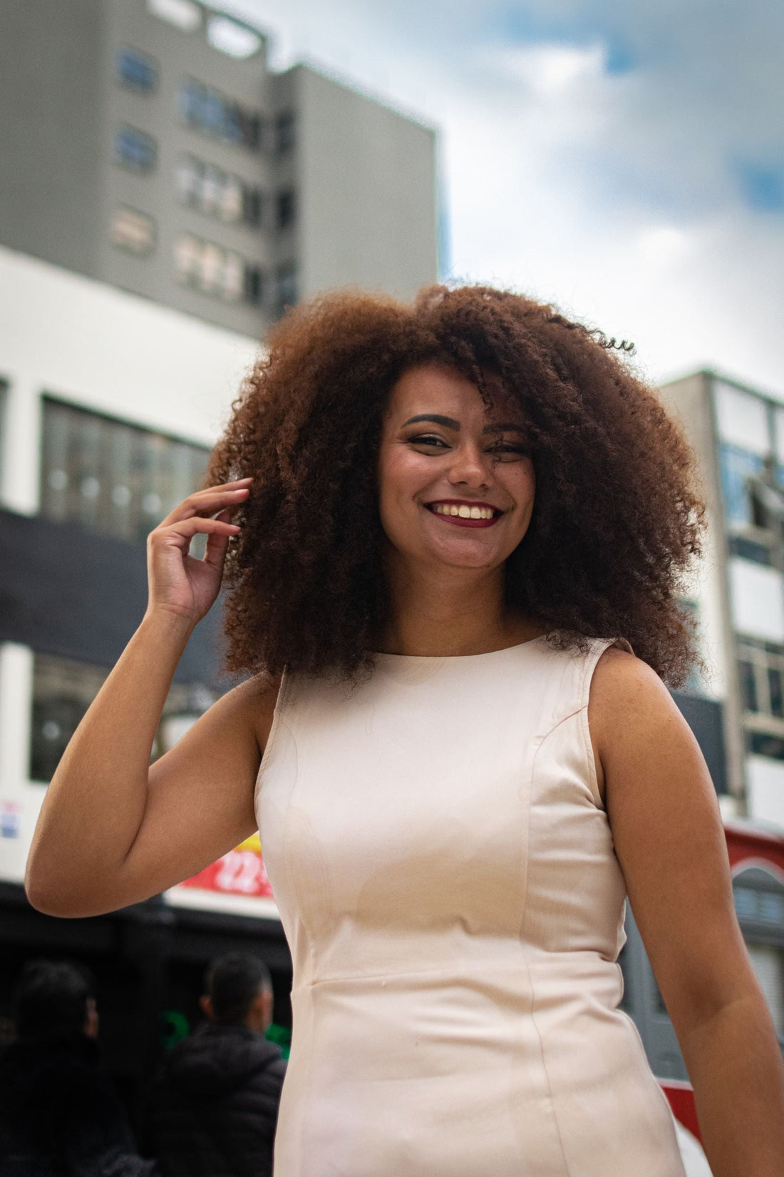 Afro Latina woman with a natural afro in the city