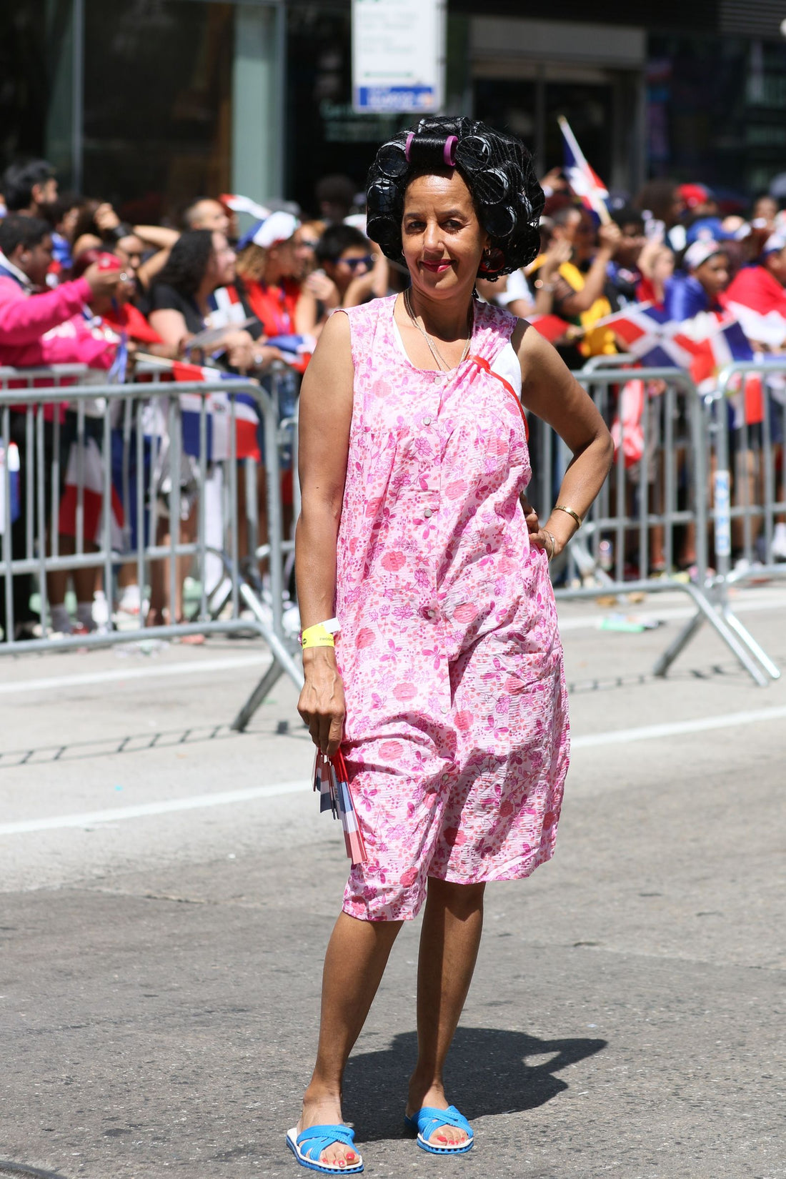 Dominican woman wearing hair rollers at the Dominican Day Parade in New York, Cultura y Textura by Grow Your Edges Back