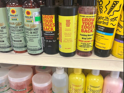 Leave-in conditioner, shampoo and foaming mousse on a retail shelf