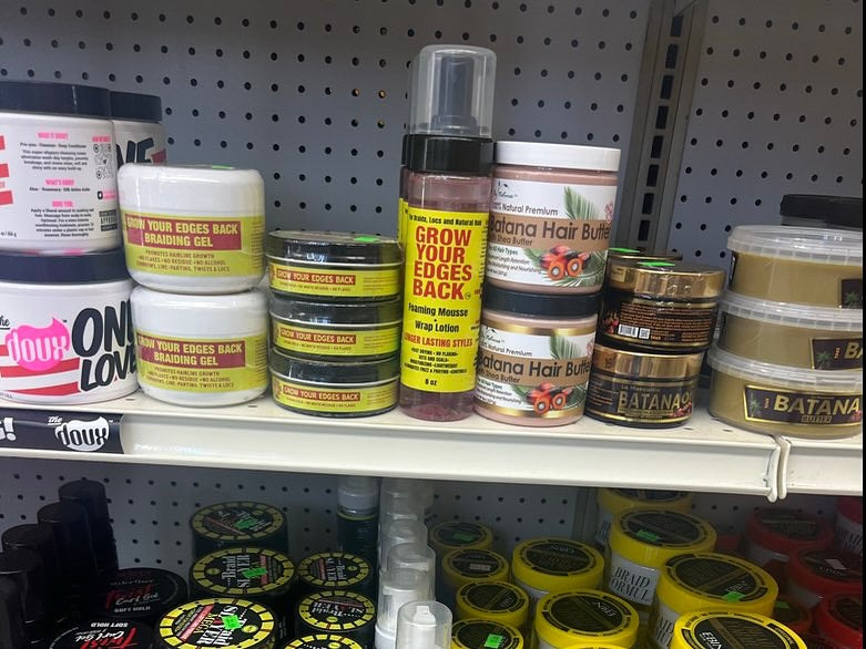 Braiding Gel, Edge Control and foaming mousse on a retail shelf