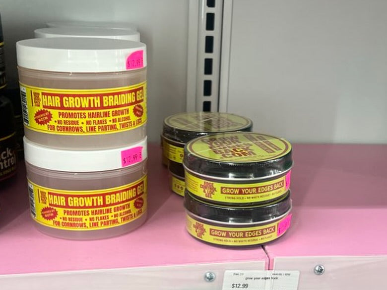 Braiding Gel and Edge Control on a pink retail shelf
